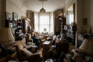 An-open-room-full-of-piled-belongings.

